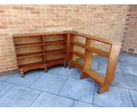 A SET OF OAK TWO SECTION CORNER OPEN BOOKSHELVES  raised on six stepped supports, each section height 84cm, width 122cm, dept