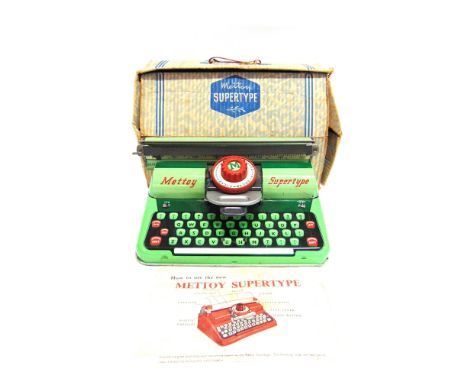 A METTOY SUPERTYPE TINPLATE TOY TYPEWRITER  green, complete with instruction leaflet, boxed.