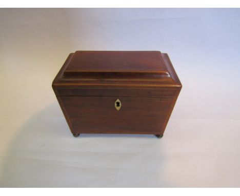 A mahogany tea caddy with lion and ring handles, bone escutcheon and banded marquetry inlay 