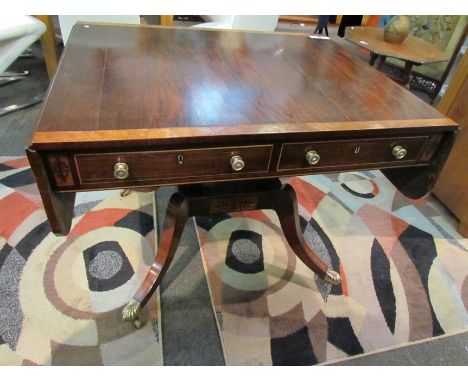 A rosewood inlaid drop flap sofa table with two drawers on brass castors, 70cm tall