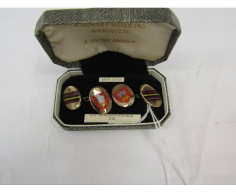 A pair of gold cased armorial enamel cufflinks of Norwich School