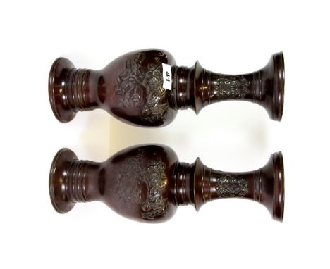 A pair of 19th century Japanese bronze vases, H. 35cms