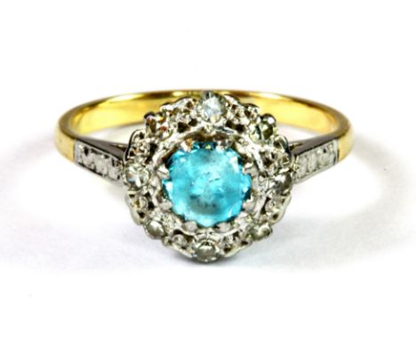 An 18ct yellow gold and platinum (stamped 18ct and plat) blue zircon and diamond cluster ring, (K.5).