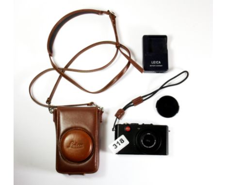A Leica digital camera with case.