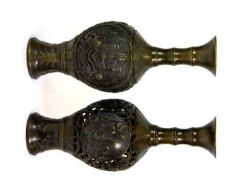 Two Chinese bronze vases, one pierced, one relief decorated, H. 25cms.