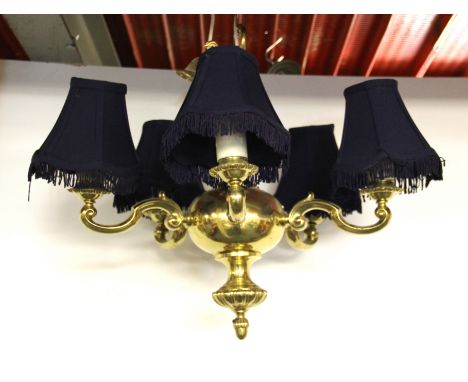 A heavy five branch brass light fitting, W. 50cms.