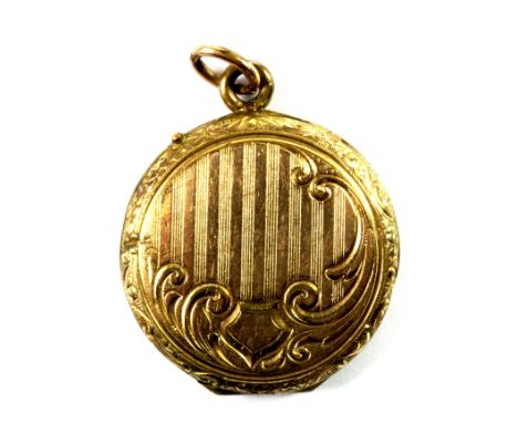 An antique yellow metal (tested minimum 9ct gold) locket portrait pendant, L. 3.2cm.