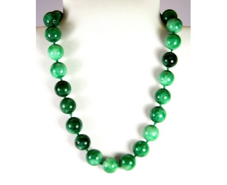 A jade bead necklace, L. 23cm.