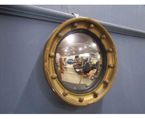 A gilt porthole mirror 32cm dia