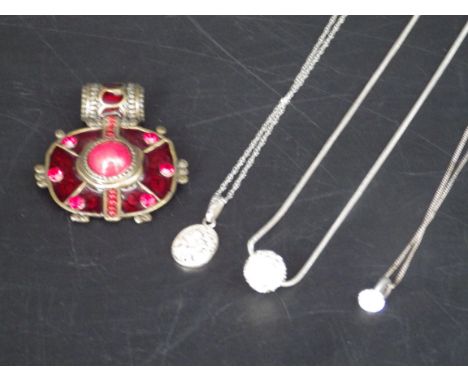 3 silver necklaces with pendants and a vintage red tribal art style pendant