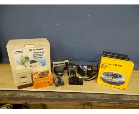 Vintage cameras, projector and a pair of binoculars&nbsp;