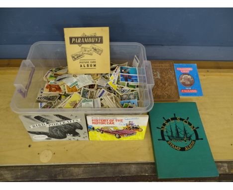 Box of mixed tea cards and a stamp album&nbsp;