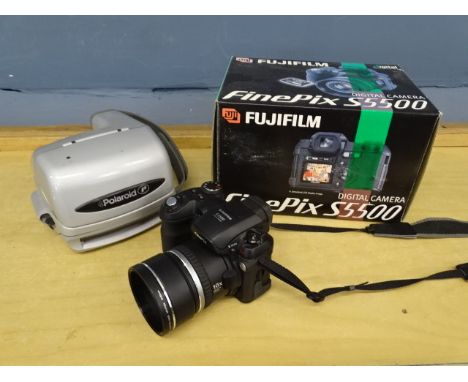 Fujifilm Finepix S5500 digital camera and Polaroid camera&nbsp;