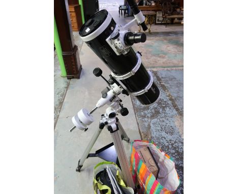 Sky Watcher reflector telescope with tripod, a Syn scan upgrade kit, constellations torch, and various accessories 