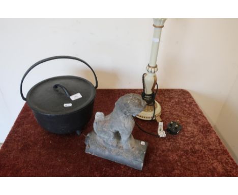 Cast iron cooking pot with loop handle and lid, a stone Dog of Foe ridge tile and a cream &amp; gilt painted table lamp (3) 