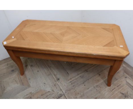 Light wood rectangular coffee table with removable top containing a various selection of games including chess, draughts, rou