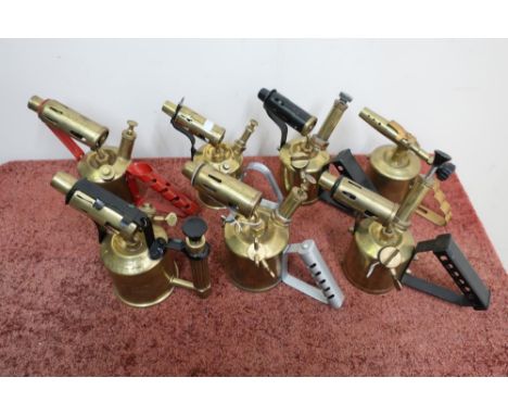 Seven vintage brass blowlamps 