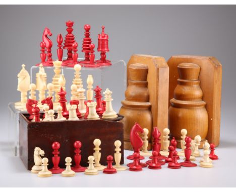 A 19TH CENTURY IVORY CHESS SET, natural and red stained, King 8.5cm high, Queen 8cm; TOGETHER WITH A 19TH CENTURY BONE EXAMPL