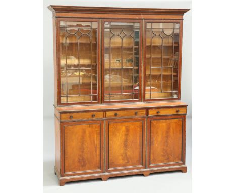 A LATE VICTORIAN INLAID MAHOGANY LIBRARY BOOKCASE, BY MAPLE &amp; CO, with dentil moulded cornice above three glazed doors ov