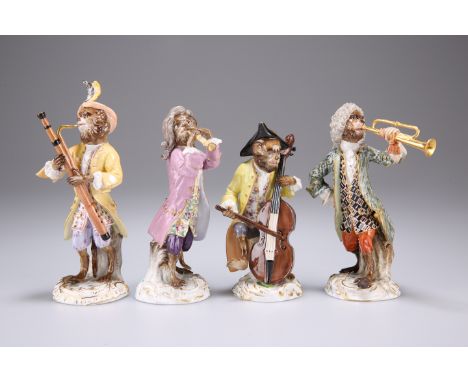 FOUR 19TH CENTURY PORCELAIN MONKEY BAND FIGURES, each modelled playing a different instrument and in a different style of dre