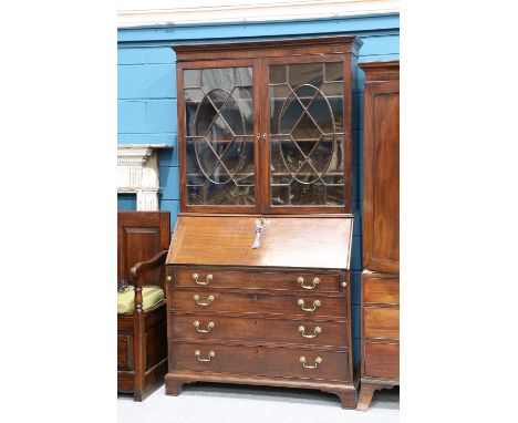 A GEORGE III MAHOGANY BUREAU BOOKCASE, the upper section with moulded cornice above a pair of astragal glazed doors, the base