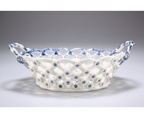 A WORCESTER BLUE AND WHITE BASKET, CIRCA 1760, pierced oval form with twin handles, in the Pine Cone pattern, crescent mark. 