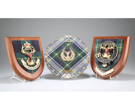 THREE WALL HANGING SHIELDS: The Gordon Highlanders post 1952 x 2, Clan Gordon and a targe shaped example Gordons ACF.&nbsp; (
