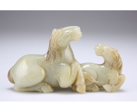 A CHINESE JADE CARVING OF TWO HORSES. 11.5cm long