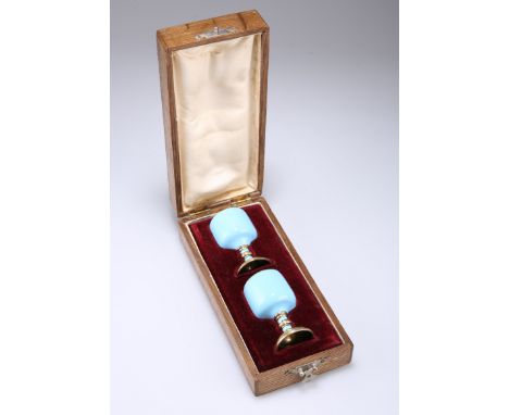 A PAIR OF RUSSIAN BLUE ENAMEL VODKA CUPS, LATE 19TH CENTURY,&nbsp;each cylindrical bowl raised on a knopped stem issuing from