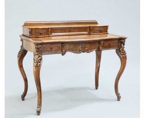 A 19TH CENTURY FRENCH ROSEWOOD DRESSING TABLE, with three-drawer superstructure above a sliding top with serpentine front ove