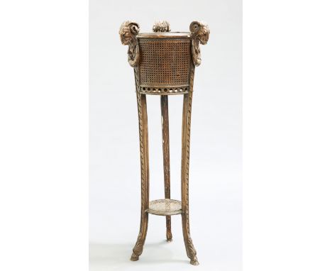A LATE 19TH CENTURY FRENCH GILT GESSO JARDINIERE, the slightly tapering cylindrical planter with three rams head finials and 
