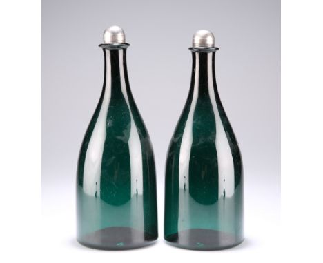 A PAIR OF EARLY 19TH CENTURY GREEN GLASS FLASK DECANTERS WITH SILVER-MOUNTED STOPPERS,&nbsp;the domed stoppers marked for Pet