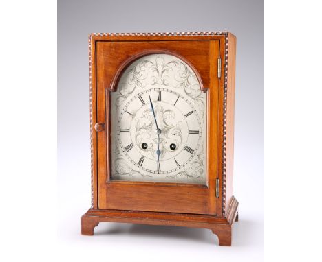 AN EARLY 20TH CENTURY FRENCH WALNUT MANTEL CLOCK, the foliate engraved break-arch steel dial with Roman numerals, two-train m
