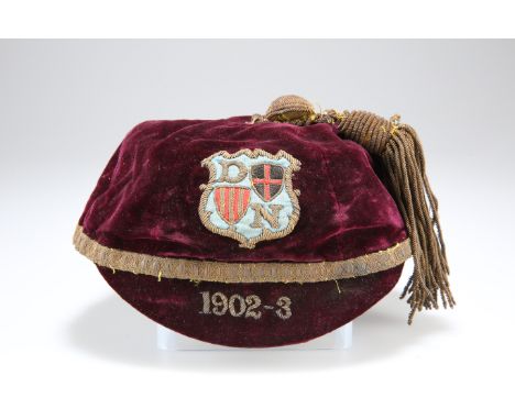 AN INTER-COUNTY ? (RUGBY ?) CAP FOR THE SEASON, THE 1902-3, the maroon ground bearing bullion embroidered shield D &amp; N wi