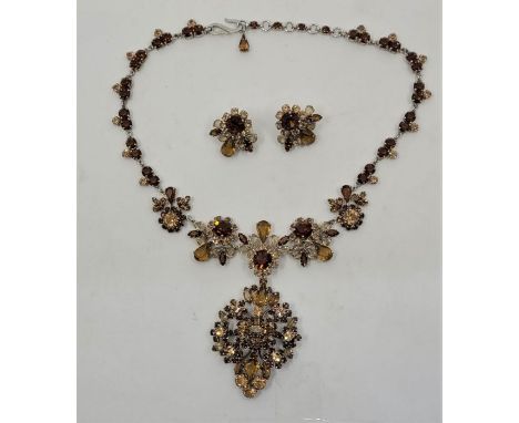 A vintage Christian Dior costume jewellery pendant necklace and earrings en suite, c.1959, set brown and yellow paste in vari