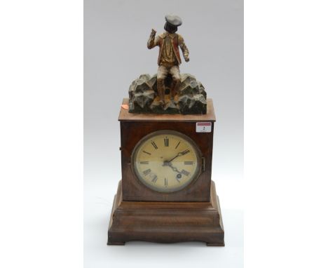 A late 19th century continental walnut cased mantel clock, having a painted dial with Roman numerals and eight day movement, 