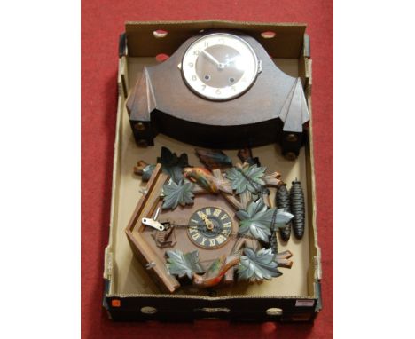 A modern cuckoo clock; together with an oak cased mantel clock