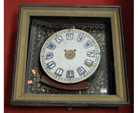 A 19th century French clock, the marble dial with raised enamelled Roman numerals, housed in a black lacquered surround with 