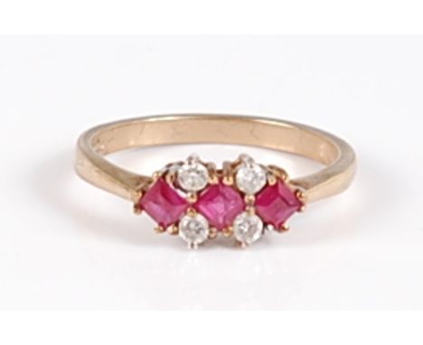 A 9ct gold, ruby and diamond set dress ring, 2.1g, size M