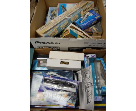 Two boxes of assorted model aircraft kits together with assembled warships etc