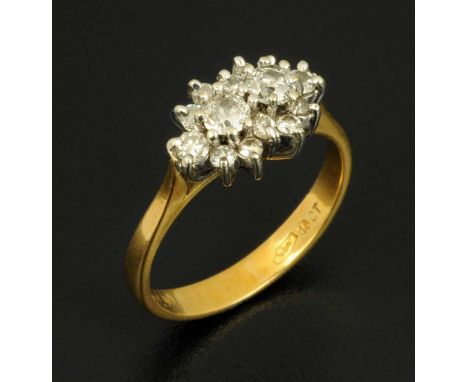 An 18 ct gold diamond cluster ring, size J/K.