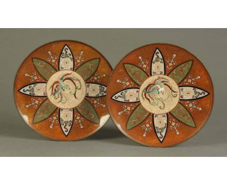 A pair of 19th century Cloisonne plates, decorated with birds and repeating foliate designs to mottled orange ground.  Diamet