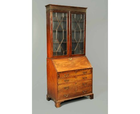 A George III mahogany bureau bookcase, with moulded cornice above a pair of thirteen pane glazed doors with wooden astragals 