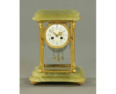An onyx and four glass mantle clock, with circular dial, Arabic numerals and two-train movement striking on a gong, by Vincen
