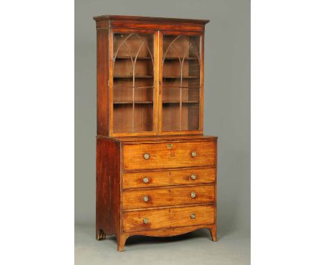 A George III mahogany secretaire bookcase, the top half with a moulded cornice above a pair of glazed doors with wooden astra