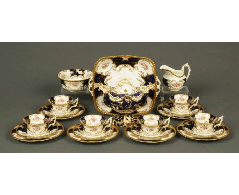 A Coalport tea service, handpainted floral sprays and heightened with gilding, comprising six cups, six saucers, six plates, 