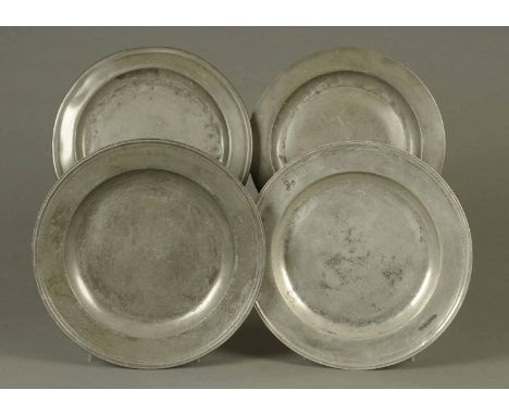 Four 18th century pewter plates, two by William Ellwood (1696-1733) diameter 43 cm, and two others each diameter 37 cm.