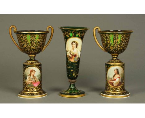 A garniture of three Bohemian green glass portrait vases.  Each height 14 ins.   CONDITION REPORT: The centre vase has a meta