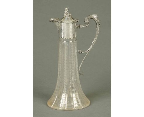 An Edwardian claret jug, with silver plated mount, elongated trumpet shaped body and bird finial.  Height 30 cm (see illustra