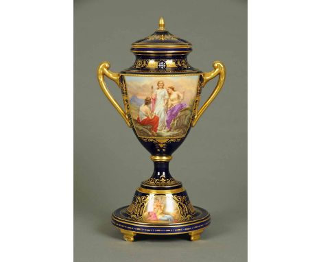 A large Vienna porcelain cabinet vase cover and stand, highlighted with gilding and decorated with signed panels by R. Forste